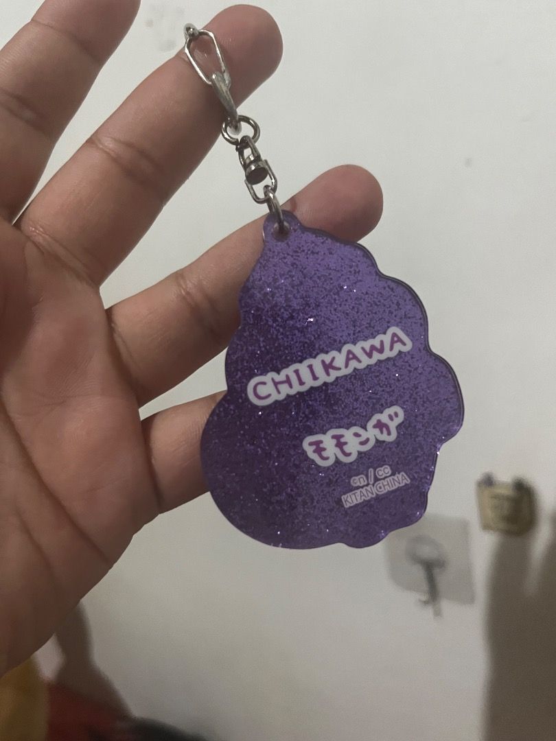 Chiikawa Momonga Glitter Acrylic Keychain Charm (Category: Character Goods) located in Tarlac. Submitted by theoshawott_adventureph (Listing ID 1469512735, Image 2). Description: - Character: Momonga from Chiikawa - Material: Clear acrylic with purple glitter backing - Hardware: Sturdy metallic clasp - Authenticity: Official merch marked Chiikawa and Kitan China on the back - Usage: Perfect accessory for bags, keys, or lanyards - Condition: Brand