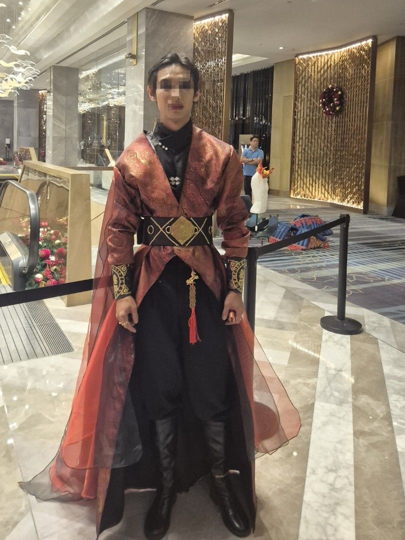 Custom-made chinese costume (Category: Traditional & Ethnic wear) located in Manila. Submitted by _mlb94 (Listing ID 1469499751, Image 2). Description: - Complete outfit set: red and gold patterned robe with sheer panels, black inner tunic, dark trousers, and wide waist belt - Accessories included: gold sleeve cuffs and decorative hanging tassel - Condition: Worn once only, clean with no tears or stains - Perfect for costumes, themed events, or p