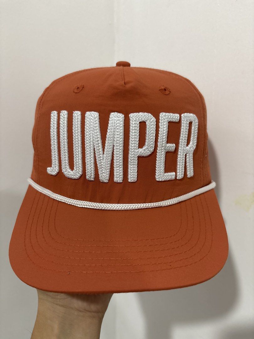 Claim Jumper '22 Orange Snapback Hat (Category: Caps & Hats) located in Calbayog City. Submitted by zaxcheus_castillo1708 (Listing ID 1469506800, Image 1). Description: - Brand: Claim Jumper (Est. 1996) - Color: Bright orange with white accents - Design: Bold embroidered 'JUMPER' lettering on front, small logo on left, '22 on right - Detail: Classic white rope across the brim - Closure: Adjustable white plastic snapback with woven tag - Condition