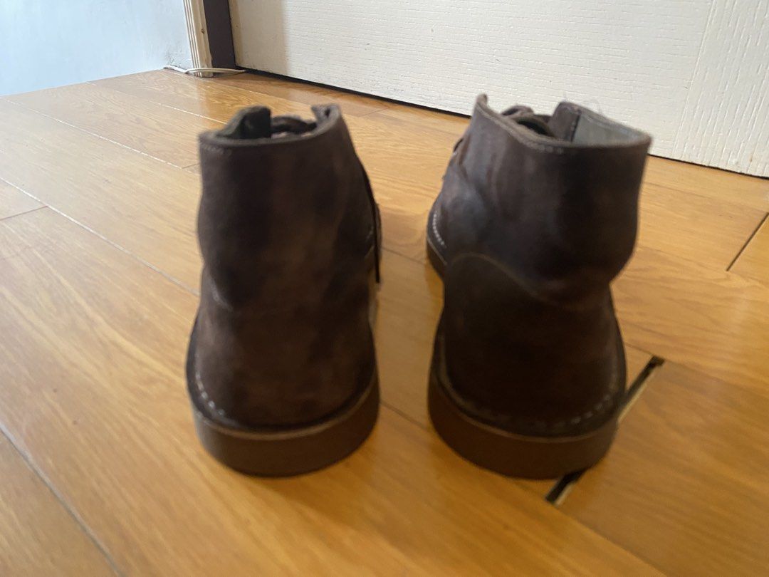 Clarks Dark Brown Suede Desert Boots (Category: Boots) located in Manila. Submitted by pureearth_866d1c (Listing ID 1469470264, Image 3). Description: - Brand: Clarks - Color/Material: Dark brown suede - Style: Classic two-eyelet lace-up desert boots with contrast sole stitching - Interior: Comfortable leather lining - Condition: Normal signs of wear on suede and soles from regular use - Versatility: Great for pairing with various casual outfits.