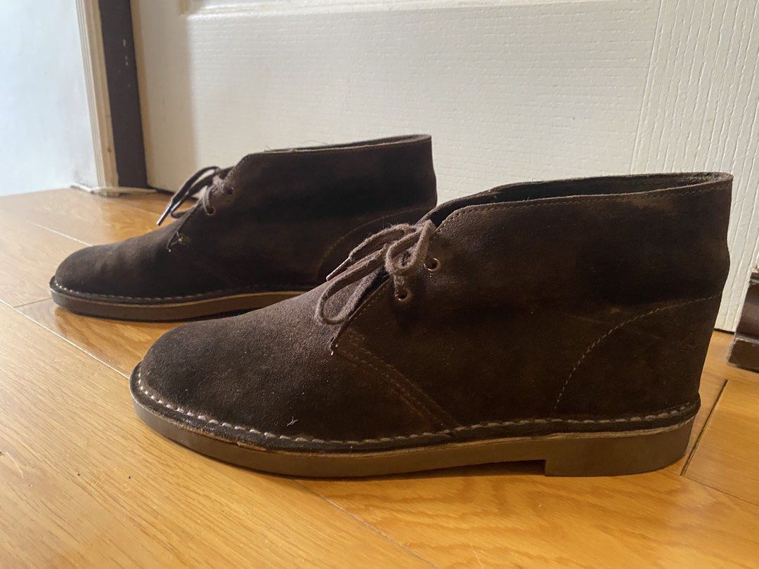 Clarks Dark Brown Suede Desert Boots (Category: Boots) located in Manila. Submitted by pureearth_866d1c (Listing ID 1469470264, Image 2). Description: - Brand: Clarks - Color/Material: Dark brown suede - Style: Classic two-eyelet lace-up desert boots with contrast sole stitching - Interior: Comfortable leather lining - Condition: Normal signs of wear on suede and soles from regular use - Versatility: Great for pairing with various casual outfits.