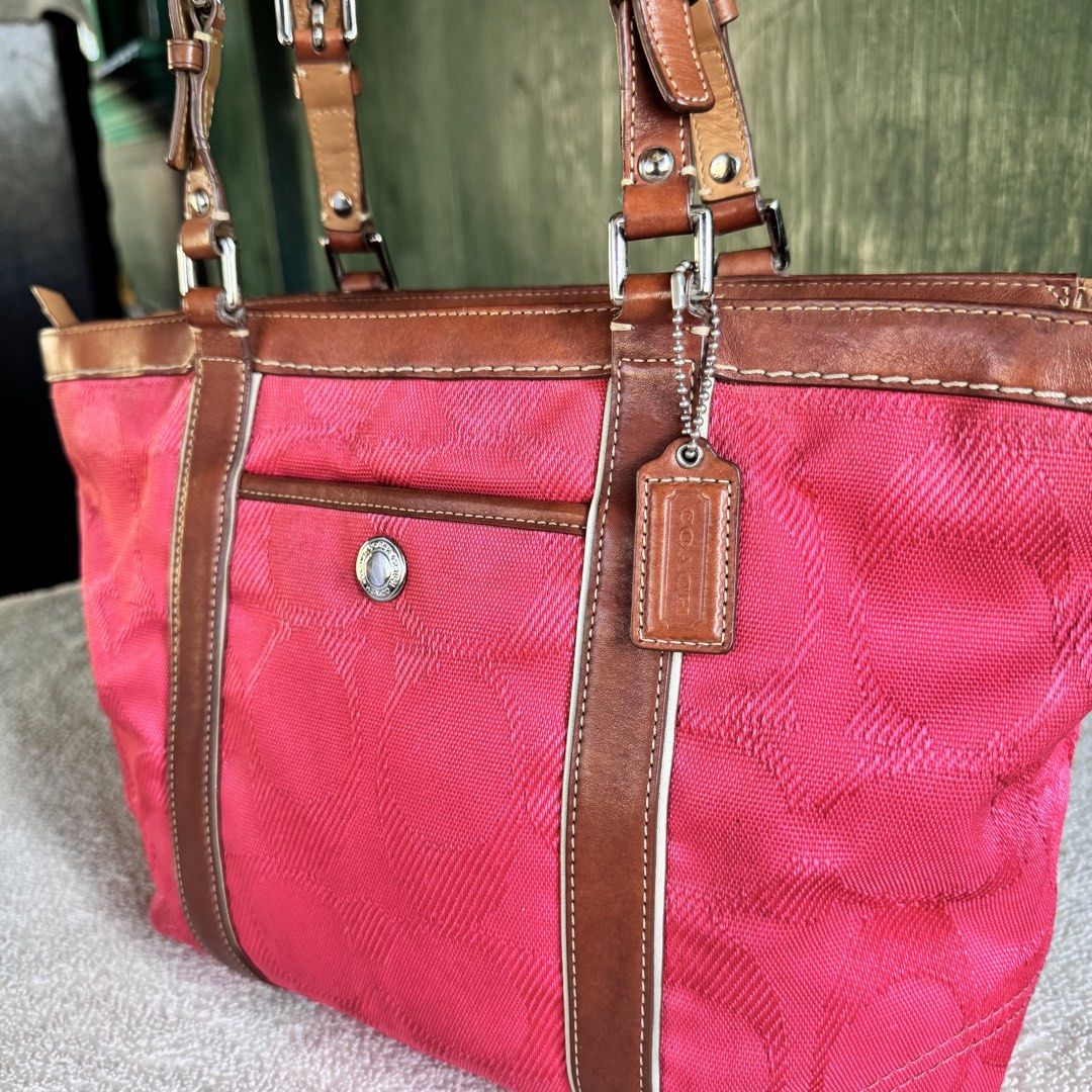 Coach Gallery Medium Tote (Category: Luxury Bags & Wallets) located in Vigan. Submitted by chiyannav (Listing ID 1469430689, Image 1). Description: • Brand & Model: Coach Gallery Tote / Shoulder Bag (A0920-F13560) • Color / Material: Coral pink signature C fabric/canvas exterior with brown leather trim and handles • Features: Silver-tone or gold-tone hardware, front exterior pocket with a snap/turn-lock closure, and the classic Coach leather hang