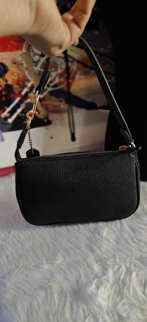 Coach Black Pebble Leather Mini Bag (Category: Luxury Bags & Wallets) located in Las Pinas. Submitted by liezel49 (Listing ID 1469424027, Image 2). Description: - Brand: Coach - Material: Premium black pebble leather - Hardware: Elegant gold-tone with front gold foil logo stamp - Closure: Secure top zipper - Inclusion: Matching hangtag - Strap: Short detachable shoulder strap with lobster clasps - Condition: Excellent, clean interior and stitchin