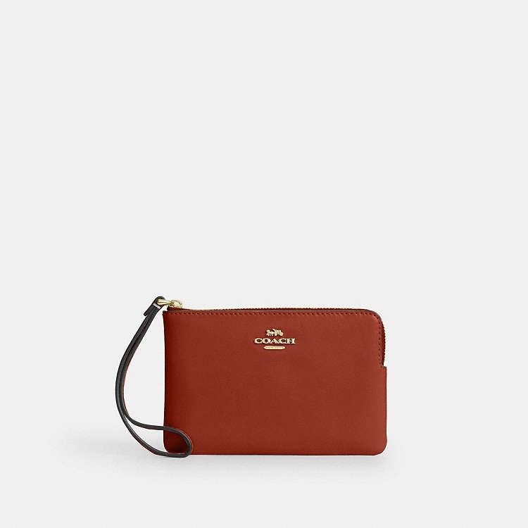 Coach Corner Zip Wristlet (Category: Wallets & Card holders) located in Las Pinas. Submitted by shopwithmira13 (Listing ID 1469508268, Image 3). Description: - Authentic Coach signature canvas corner zip wristlet - Color: Black tone with sleek silver hardware - Compact pouch design with a convenient wrist strap - Secure zip-top closure with durable fabric lining - Ideal for holding cards, cash, and keys on the go - 100% genuine and well-maintaine