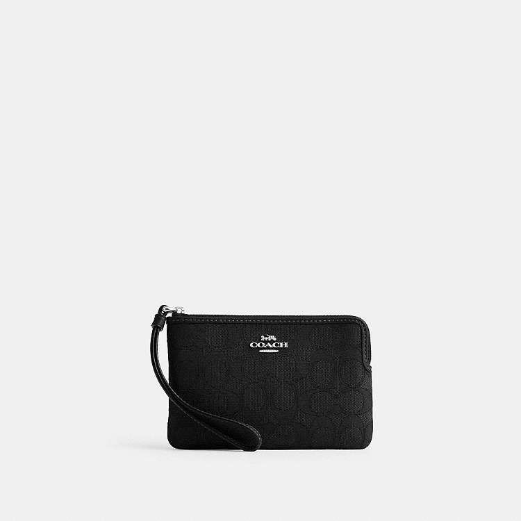 Coach Corner Zip Wristlet (Category: Wallets & Card holders) located in Las Pinas. Submitted by shopwithmira13 (Listing ID 1469508268, Image 1). Description: - Authentic Coach signature canvas corner zip wristlet - Color: Black tone with sleek silver hardware - Compact pouch design with a convenient wrist strap - Secure zip-top closure with durable fabric lining - Ideal for holding cards, cash, and keys on the go - 100% genuine and well-maintaine