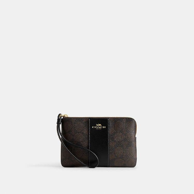 Coach Corner Zip Wristlet (Category: Wallets & Card holders) located in Las Pinas. Submitted by shopwithmira13 (Listing ID 1469509721, Image 2). Description: - Authentic Coach signature monogram coated canvas in dark brown - Stylish solid black center vertical stripe and matching black wrist strap - Elegant gold-tone hardware and secure zip closure - Iconic Coach New York logo stamped in gold on the front - Compact and convenient size for cards, 