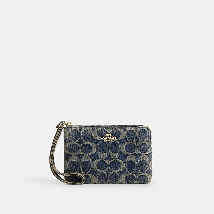 Coach Corner Zip Wristlet (Category: Wallets & Card holders) located in Las Pinas. Submitted by shopwithmira13 (Listing ID 1469509956, Image 2). Description: - 100% Authentic Coach wristlet - Secure zip-top closure with attached wrist strap - Features the classic Coach horse and carriage logo - Compact and handy size for cards, cash, and keys - Available finishes: Black metallic leather, denim signature jacquard, blue signature pattern, and burgu