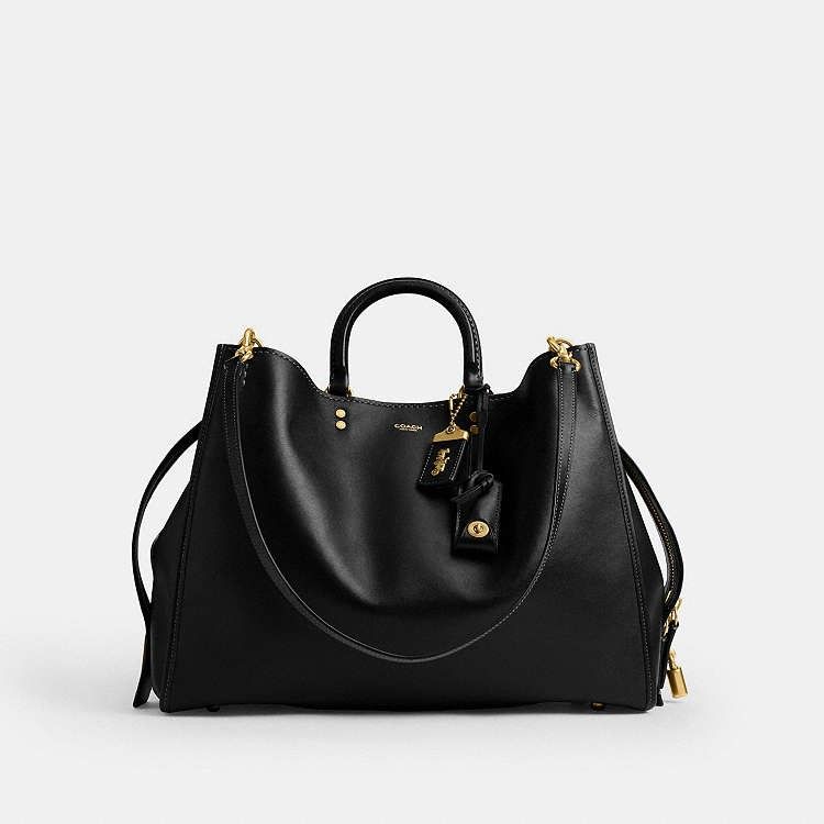 Coach Empire 40 in Black (Category: Shoulder Bags) located in Las Pinas. Submitted by shopwithmira13 (Listing ID 1469450414, Image 2). Description: Measurements Length: 15.75" Height: 12.5" Width: 6.75" Materials soft grain leather Leather and regenerative cotton lining Handle Handles with 3.75" drop Strap Detachable straps with 11" drop for shoulder wear Detachable long strap with 21.5" drop for shoulder or crossbody wear.