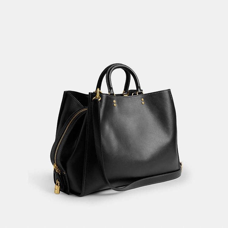 Coach Empire 40 in Black (Category: Shoulder Bags) located in Las Pinas. Submitted by shopwithmira13 (Listing ID 1469450414, Image 3). Description: Measurements Length: 15.75" Height: 12.5" Width: 6.75" Materials soft grain leather Leather and regenerative cotton lining Handle Handles with 3.75" drop Strap Detachable straps with 11" drop for shoulder wear Detachable long strap with 21.5" drop for shoulder or crossbody wear.