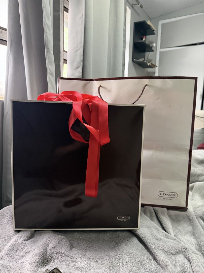 Coach Box Gift Set (Category: Luxury Bags & Wallets) located in Baguio. Submitted by _herarchives (Listing ID 1469458642, Image 3). Description: Available 🎀 - from japan - complete set with shopping bag, ribbon & wrapping paper Dimensions: 36.5 x 36.5 x 14 cm.