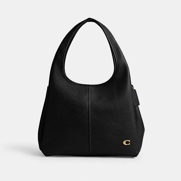 Coach Lana Shoulder Bag (Category: Shoulder Bags) located in Las Pinas. Submitted by shopwithmira13 (Listing ID 1469436944, Image 3). Description: Measurements Length: 13.25" Height: 10.25" Width: 7.75" Materials Polished pebble leather Leather and fabric lining Handle Handles with 10" drop Features Inside snap pocket Snap closure Zip compartment Four protective feet at base.
