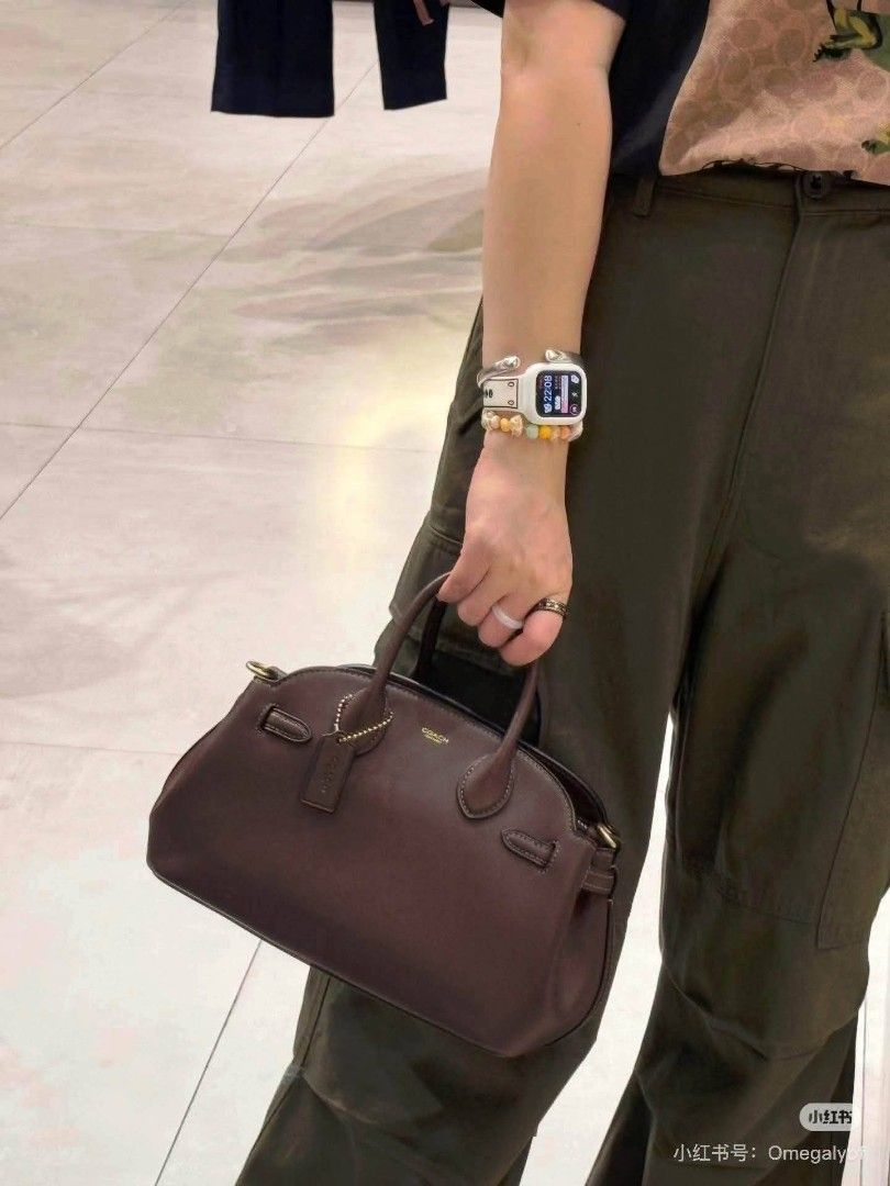 Coach Leather Satchel Handbag Brown Black (Category: Luxury Bags & Wallets) located in Rizal. Submitted by vanbdc24 (Listing ID 1469508906, Image 2). Description: - Authentic Coach leather satchel bag - Colors available: Classic Brown and Sleek Black - Structured top-handle design with stylish side strap details - Features a signature hanging logo tag - Compact size, ideal for carrying daily essentials - Crafted with a clean, smooth leather finis