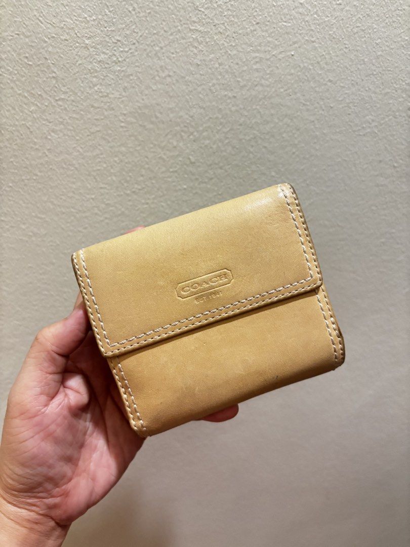 Coach Leather Turnlock Wallet -Vintage Y2k (Category: Wallets & Card holders) located in Muntinlupa City. Submitted by btscerpts.ph (Listing ID 1469398003, Image 2). Description: ✨Coach Leather Turnlock Wallet ✨ -Vintage Y2k - Authentic Coach compact leather wallet - Stylish tan and light blue colorway with contrast white stitching - Secure turnlock closure on the front flap - Interior includes multiple card slots, an ID window, and cash compartm