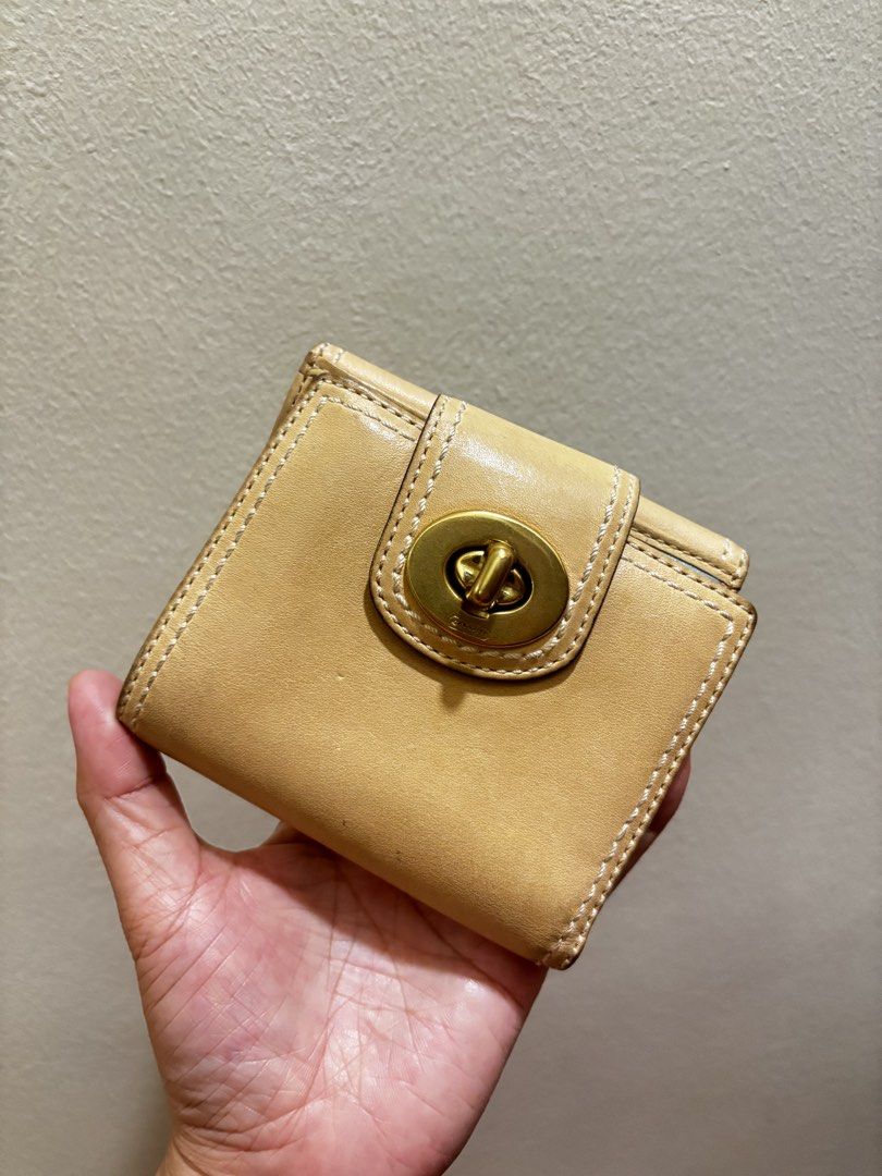 Coach Leather Turnlock Wallet -Vintage Y2k (Category: Wallets & Card holders) located in Muntinlupa City. Submitted by btscerpts.ph (Listing ID 1469398003, Image 1). Description: ✨Coach Leather Turnlock Wallet ✨ -Vintage Y2k - Authentic Coach compact leather wallet - Stylish tan and light blue colorway with contrast white stitching - Secure turnlock closure on the front flap - Interior includes multiple card slots, an ID window, and cash compartm