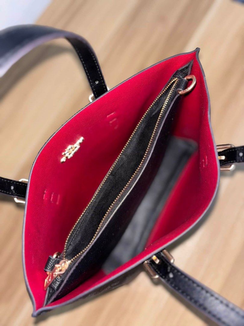 Coach Mollie Hand & Shoulder Bag Luxury (Category: Shoulder Bags) located in Angeles City. Submitted by cullengray (Listing ID 1469468552, Image 3). Description: Signature Canvas in Black Made in Vietnam from signature coated canvas with smooth leather trim, featuring a KK zip closure for durability and everyday use. • Comfortable handles with a 43/4” drop for easy carrying • Detachable strap with 22” drop for shoulder or crossbody wear. • Featur