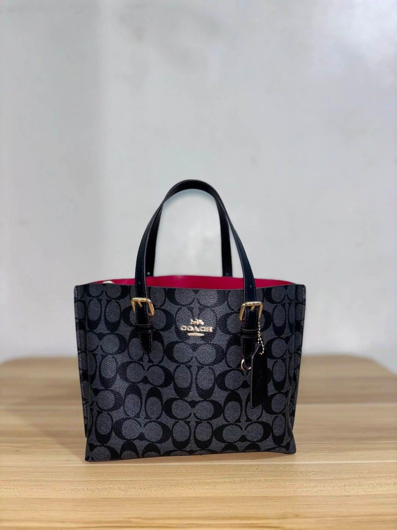 Coach Mollie Hand & Shoulder Bag Luxury (Category: Shoulder Bags) located in Angeles City. Submitted by cullengray (Listing ID 1469468552, Image 2). Description: Signature Canvas in Black Made in Vietnam from signature coated canvas with smooth leather trim, featuring a KK zip closure for durability and everyday use. • Comfortable handles with a 43/4” drop for easy carrying • Detachable strap with 22” drop for shoulder or crossbody wear. • Featur