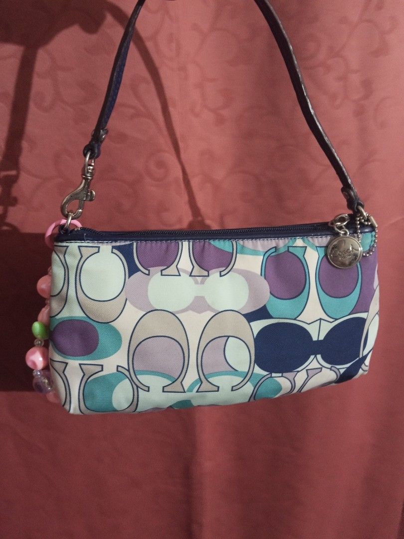 Coach Multi-color Kili Bag (Category: Shoulder Bags) located in Makati City. Submitted by makati_metro (Listing ID 1469488122, Image 3). Description: **Last price posted. ALL details are already posted. In great condition and smells clean. Super cute Mini Kili bag that fits your phone and other small essentials. Also comes with built-in card slots for extra convenience. Kindly check all photos to appreciate its condition. Please message only if y