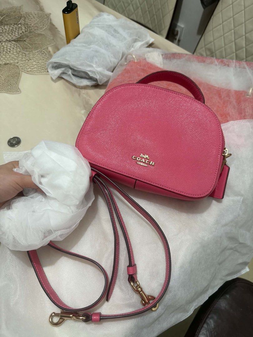 Coach Pink Leather Crossbody Handbag (Category: Luxury Bags & Wallets) located in Bocaue. Submitted by nhaomiee (Listing ID 1469459509, Image 1). Description: - Authentic Coach dome crossbody bag in a vibrant bright pink color - Crafted from luxurious pebbled leather texture throughout - Elegant gold-tone hardware and secure zipper closure - Features a convenient top handle and a matching adjustable shoulder strap - Impeccably clean interior and 