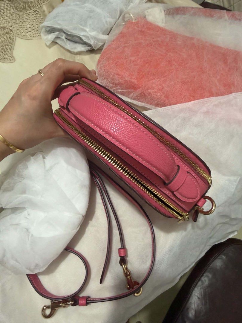 Coach Pink Leather Crossbody Handbag (Category: Luxury Bags & Wallets) located in Bocaue. Submitted by nhaomiee (Listing ID 1469459509, Image 3). Description: - Authentic Coach dome crossbody bag in a vibrant bright pink color - Crafted from luxurious pebbled leather texture throughout - Elegant gold-tone hardware and secure zipper closure - Features a convenient top handle and a matching adjustable shoulder strap - Impeccably clean interior and 