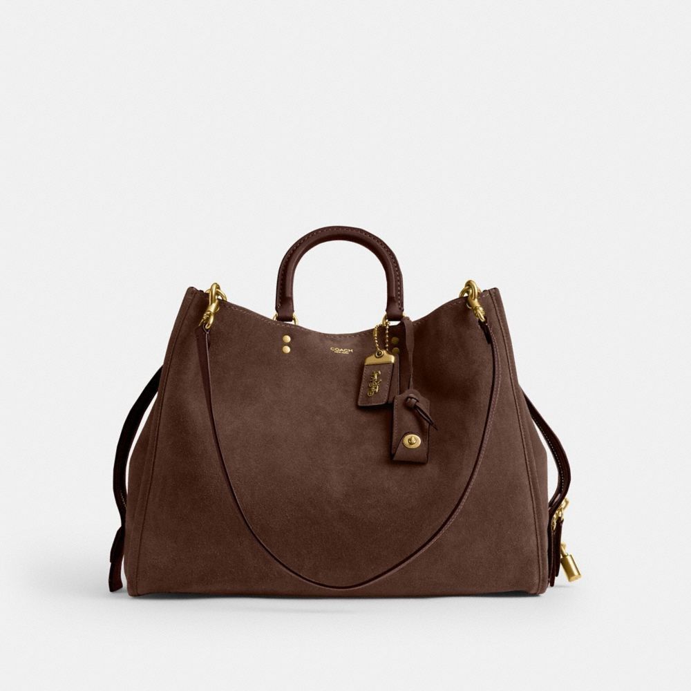 Coach Rogue 40 in Warm/Dark Chocolate (Category: Shoulder Bags) located in Las Pinas. Submitted by shopwithmira13 (Listing ID 1469448344, Image 2). Description: Measurements Length: 15.75" Height: 12.5" Width: 6.75" Materials Suede and soft grain leather Leather and regenerative cotton lining Handle Handles with 3.75" drop Strap Detachable straps with 11" drop for shoulder wear Detachable long strap with 21.5" drop for shoulder or crossbody wear.