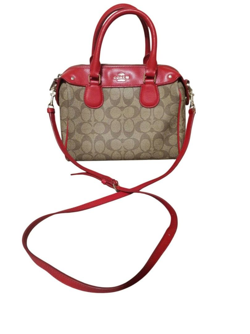 Coach Signature Mini Bennett Satchel Brown Red (Category: Luxury Bags & Wallets) located in Urdaneta. Submitted by assortedprelovedd (Listing ID 1469460892, Image 1). Description: - Authentic Coach signature monogram print with striking red leather trim - Dual top handles plus a detachable, adjustable crossbody strap for versatile styling - Elegant gold-tone hardware and secure zip-top closure - Compact size with a clean interior lining, perfect 