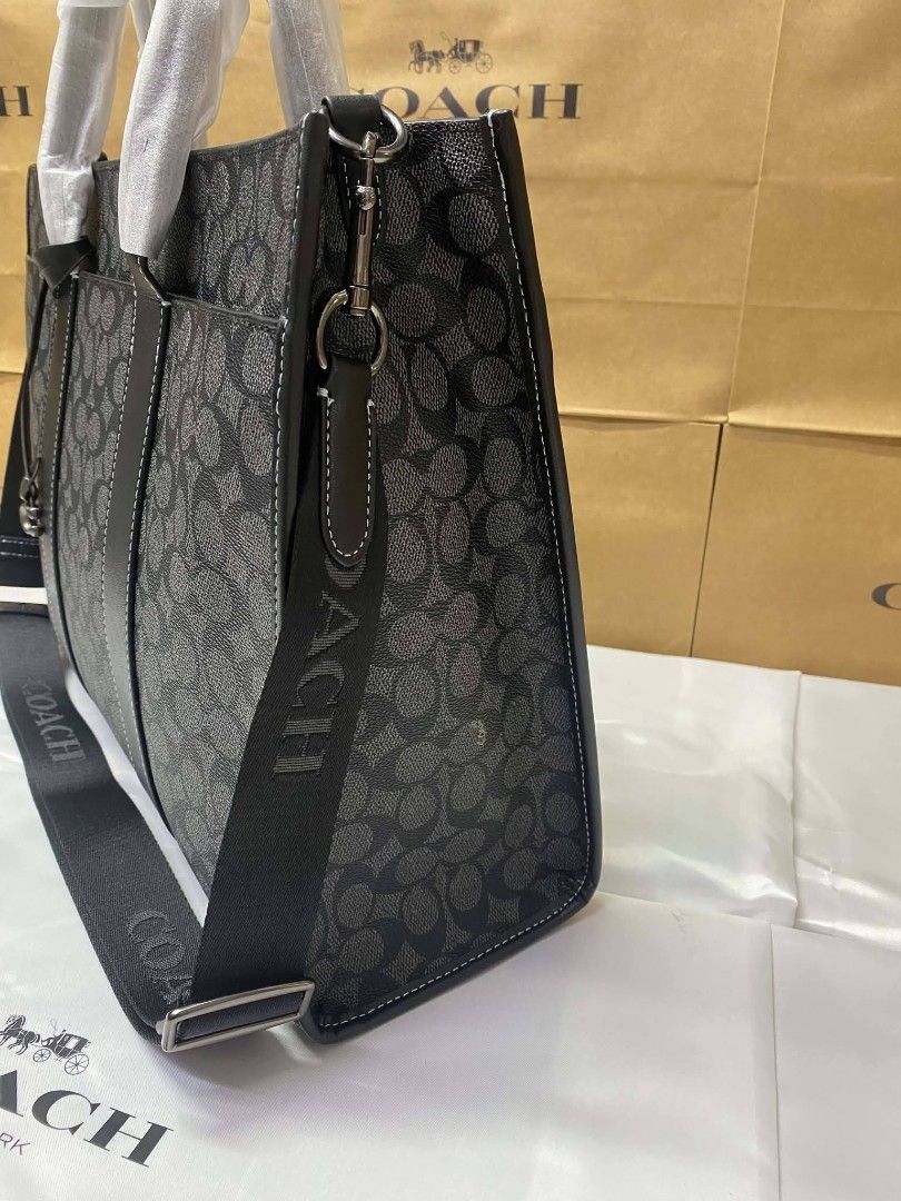 Coach Signature Monogram Tote Bag Black (Category: Luxury Bags & Wallets) located in Rizal. Submitted by vanbdc24 (Listing ID 1469509026, Image 3). Description: - Brand: Coach - Color: Black Signature Monogram Canvas - Condition: Brand New with protective wrapping on handles - Features: Secure zip top closure, spacious interior lining, interior zip and slip pockets - Versatility: Includes a detachable crossbody strap and classic hangtag - Perfect