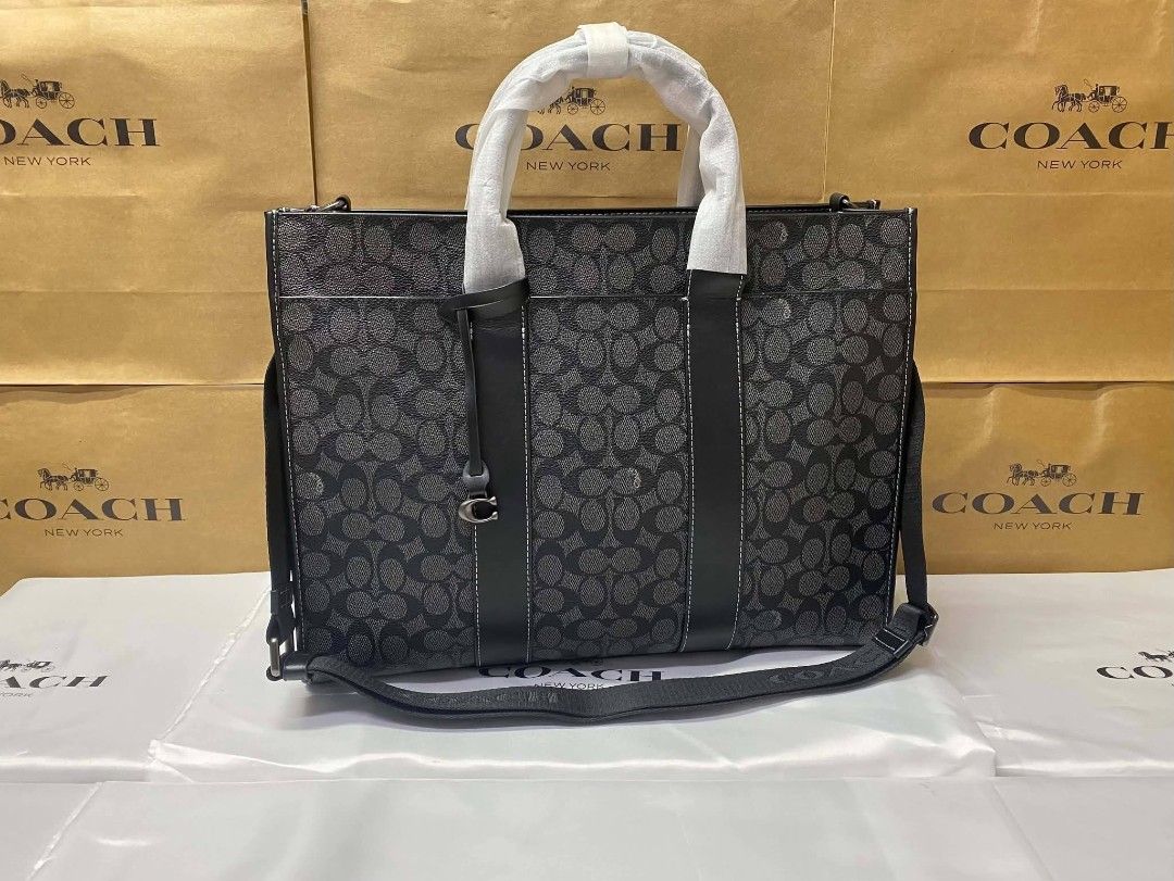 Coach Signature Monogram Tote Bag Black (Category: Luxury Bags & Wallets) located in Rizal. Submitted by vanbdc24 (Listing ID 1469509026, Image 1). Description: - Brand: Coach - Color: Black Signature Monogram Canvas - Condition: Brand New with protective wrapping on handles - Features: Secure zip top closure, spacious interior lining, interior zip and slip pockets - Versatility: Includes a detachable crossbody strap and classic hangtag - Perfect