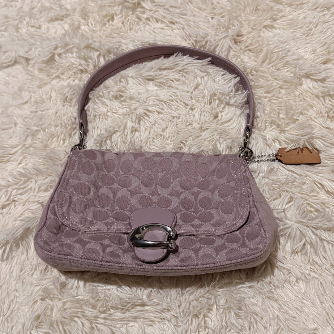 Coach Soft Tabby Shoulder Bag (Category: Luxury Bags & Wallets) located in Pasay City. Submitted by erinsclosetph (Listing ID 1469431303, Image 1). Description: Beautiful lavender Coach Soft Tabby Shoulder Bag in excellent pre-loved condition. Canvas is in good condition, and hardware remains tarnish-free. Minor stain in the inner lining. .