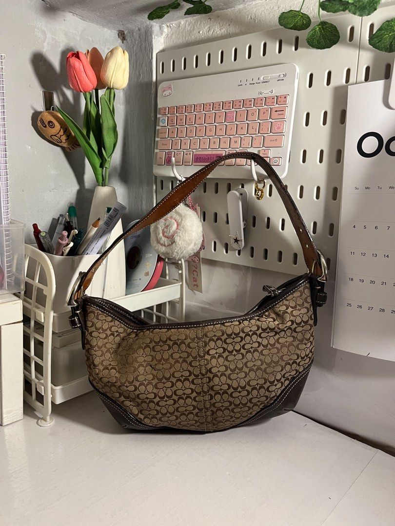 Coach Soho Mini Signature Hobo (Category: Luxury Bags & Wallets) located in Muntinlupa City. Submitted by pique.unique (Listing ID 1469534997, Image 2). Description: - Vintage Signature Soho Coach - Authenticity Guaranteed - Size Small Only (Very Cute!) - Excellent Canvas Condition - No rubs, Minimal Signs of wear only in leather (See photo to Appreciate the item) - Must Cop! Price: 5,000 .