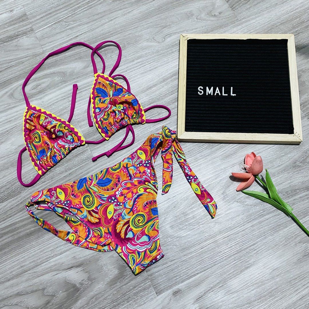 Colorful Patterned Two-Piece Bikini (Category: Bikinis & Swimsuits) located in Caloocan City. Submitted by lovemyclothes21 (Listing ID 1469497490, Image 1). Description: - Vibrant pink, yellow, and blue psychedelic print - Triangle top with adjustable string ties - Matching bottoms with convenient side ties - Size: Small - Ideal for beach trips, pool days, and vacations - Brand new and ready to ship!.