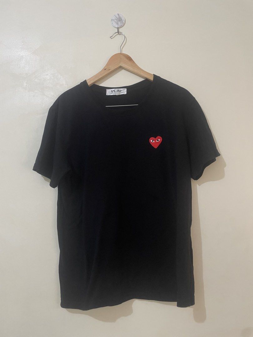 COMME des GARÇONS PLAY Black Heart Tee (Category: Activewear) located in Davao. Submitted by thegraildept2026 (Listing ID 1469415745, Image 1). Description: - Brand: COMME des GARÇONS PLAY - Color: Black - Size: Extra Large (XL) - Material: 100% Cotton - Details: Iconic embroidered red heart patch on chest, crew neckline, short sleeves - Fit: Standard fit - Condition: Clean front and back with no rear graphics.