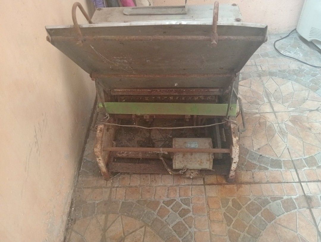 Commercial Electric Bread Slicer Machine (Category: Industrial Equipment) located in Manila. Submitted by livelion_7f58e1 (Listing ID 1469411237, Image 3). Description: - Commercial electric bread slicer for bakery use - Heavy-duty stainless steel construction with built-in motor - Gravity feed slide tray for easy operation - Condition: Shows significant rust and dirt from storage, untested - Requires deep cleaning and servicing before use - Heav