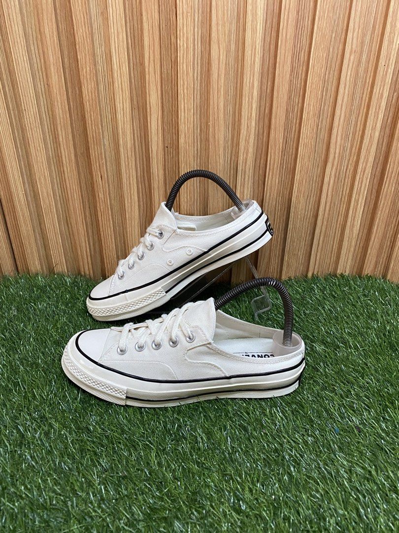 Converse Chuck 70 Mule Low Canvas Off White (Category: Sneakers) located in Butuan. Submitted by chang_14 (Listing ID 1469502110, Image 1). Description: - Model: Converse Chuck 70 Mule Slip-On - Color: Off-white canvas upper with black pinstripe midsole - Size: US Men's 5 / Women's 7, UK 5, EUR 37.5 - Condition: Clean overall, minimal wear on soles - Features: Classic low-top mule design with durable brown rubber outsole.