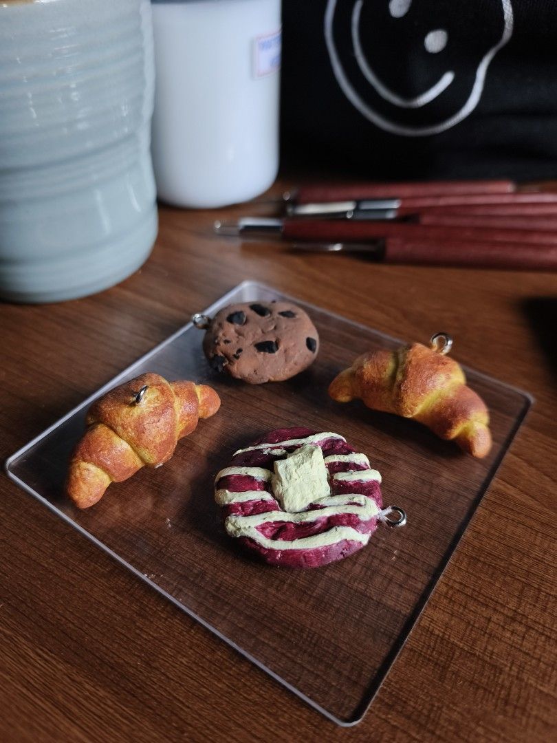 cookie and croissant keychains (Category: Handmade Craft) located in Imus. Submitted by kennymakes.things (Listing ID 1469506550, Image 1). Description: You can place an order on my website 🫶🏻 https://kennymakesthings.base44.app.
