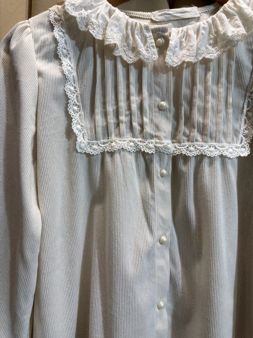 CORDUROY BUTTON-DOWN BLOUSE (Category: Longsleeves) located in Manila. Submitted by glamstylemnl (Listing ID 1469467200, Image 2). Description: ♡ SIZE: L-XL ♡ BUST: 42 ♡ Swipe left to see the actual color & details ♡ peter pan collar with lace trim, pintucked square yoke, ruffled cuffs, with washable light blue stains ♡ HQ • 8/10 ♡ Ready to wear 👚.