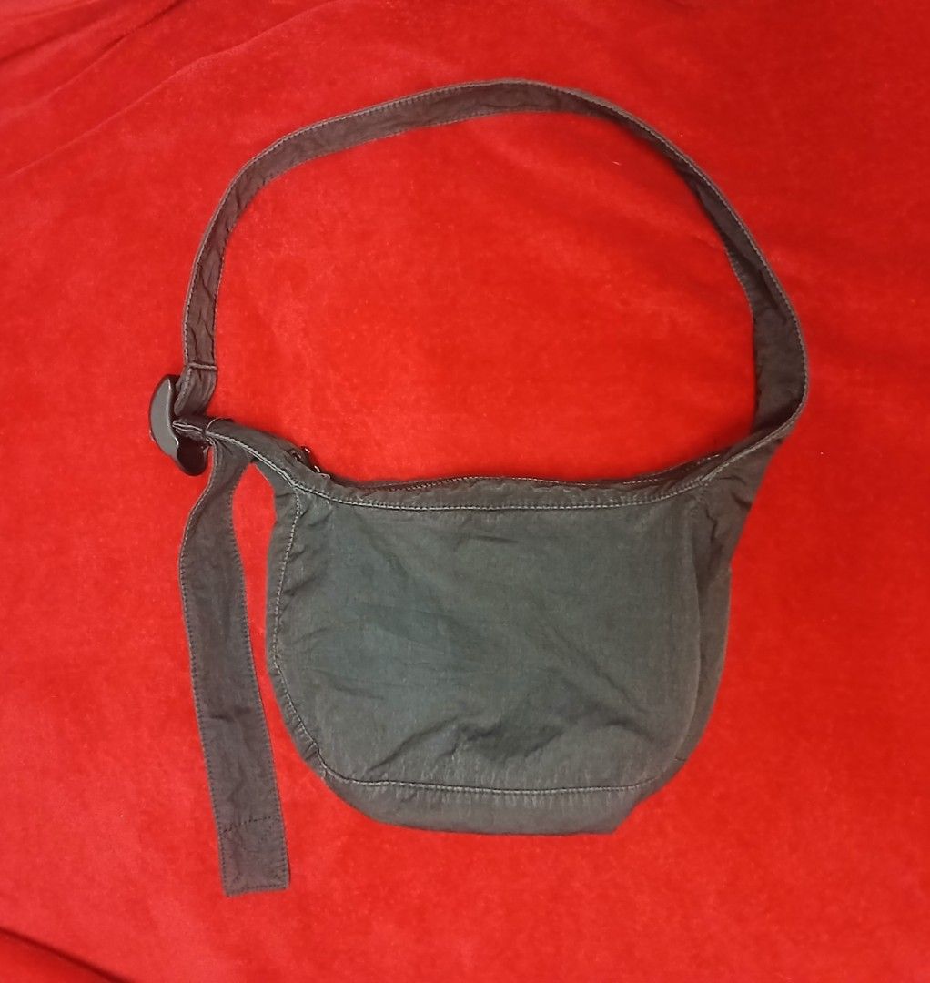 COS Crescent Crossbody Bag — Black (Category: Cross-body Bags) located in Cagayan de Oro. Submitted by susanthrifts (Listing ID 1469466127, Image 1). Description: ​Condition: Pre-owned, good condition with normal gentle edge wear along the seams. ​Details: ​Lightweight garment-washed nylon/poly fabric with a soft, slouchy crescent silhouette. ​Secure top zip closure and adjustable strap with side buckle detail. ​Interior COS label and official pr