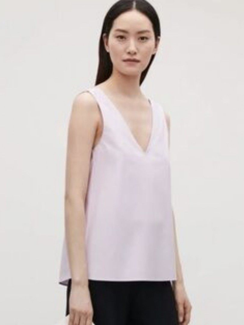 COS Light Pink V-Neck Tank Top (Category: Sleeveless) located in General Santos City (Dadiangas). Submitted by amzonshop (Listing ID 1469447907, Image 1). Description: - Brand: COS - Style: Sleeveless top with deep V-neck (front and back) - Color: Soft light pink - Fit: Relaxed fit with cute pleated gathering at the lower back - Material: Smooth, lightweight woven fabric - Condition: Excellent, perfect for warm weather and minimalist styling Bust