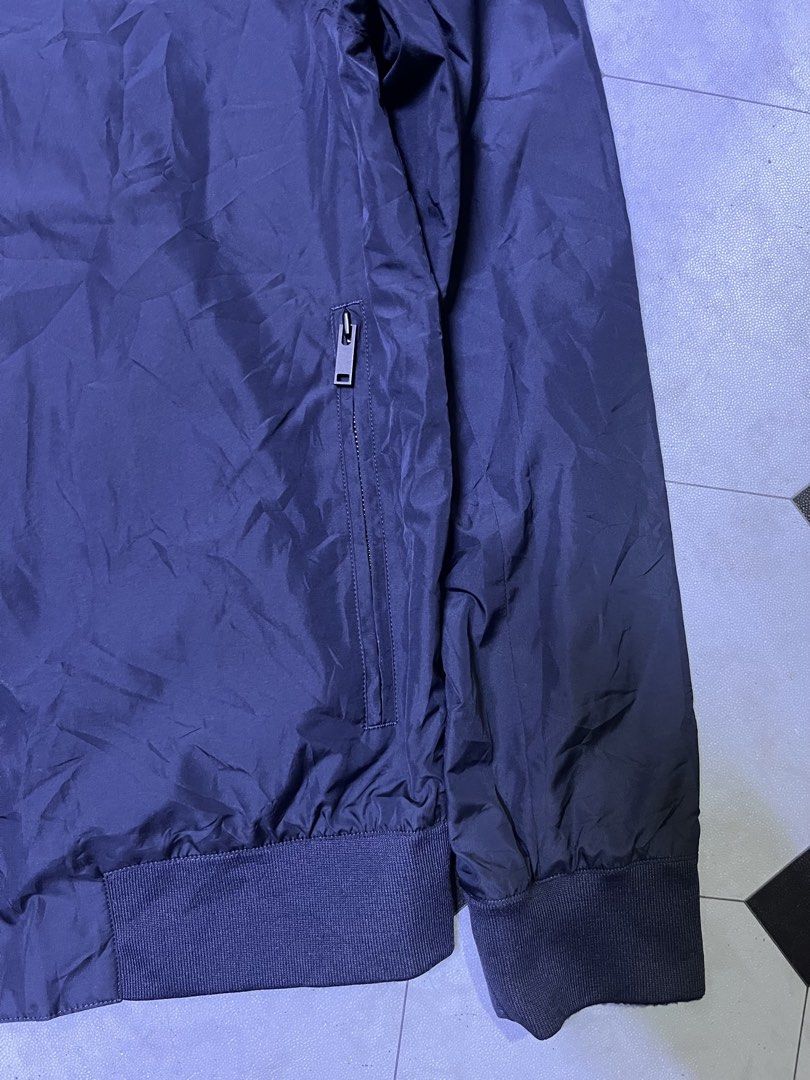 COS Navy Blue Zip Bomber Jacket Size XS (Category: Coats, Jackets and Outerwear) located in Manila. Submitted by ba_thrifted (Listing ID 1469525624, Image 3). Description: - Brand/Model: COS navy blue bomber jacket - Size: EUR XS - Design: Clean minimalist style with full front zipper - Pockets: Two secure zippered side pockets - Details: Comfortable ribbed collar, cuffs, and hem - Material: Lightweight fabric, ideal for layering in cooler weathe