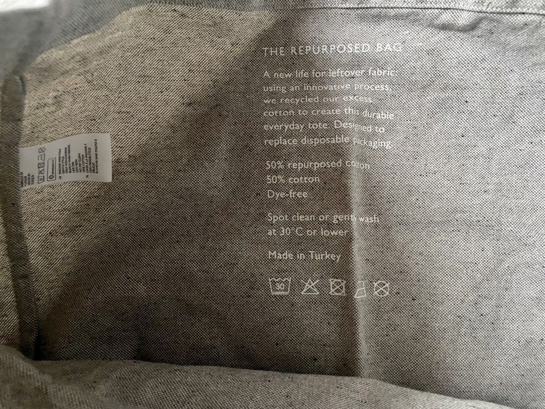 COS The Repurposed Cotton Tote Bag Grey (Category: Tote Bags) located in Tabaco. Submitted by devskie (Listing ID 1469472514, Image 3). Description: - Authentic COS The Repurposed Bag in a stylish grey speckled look - Crafted from 50% repurposed cotton and 50% regular cotton - Eco-friendly, dye-free design made to replace disposable packaging - Features the iconic white COS logo printed on the front pocket - Sturdy build ideal for everyday use - 