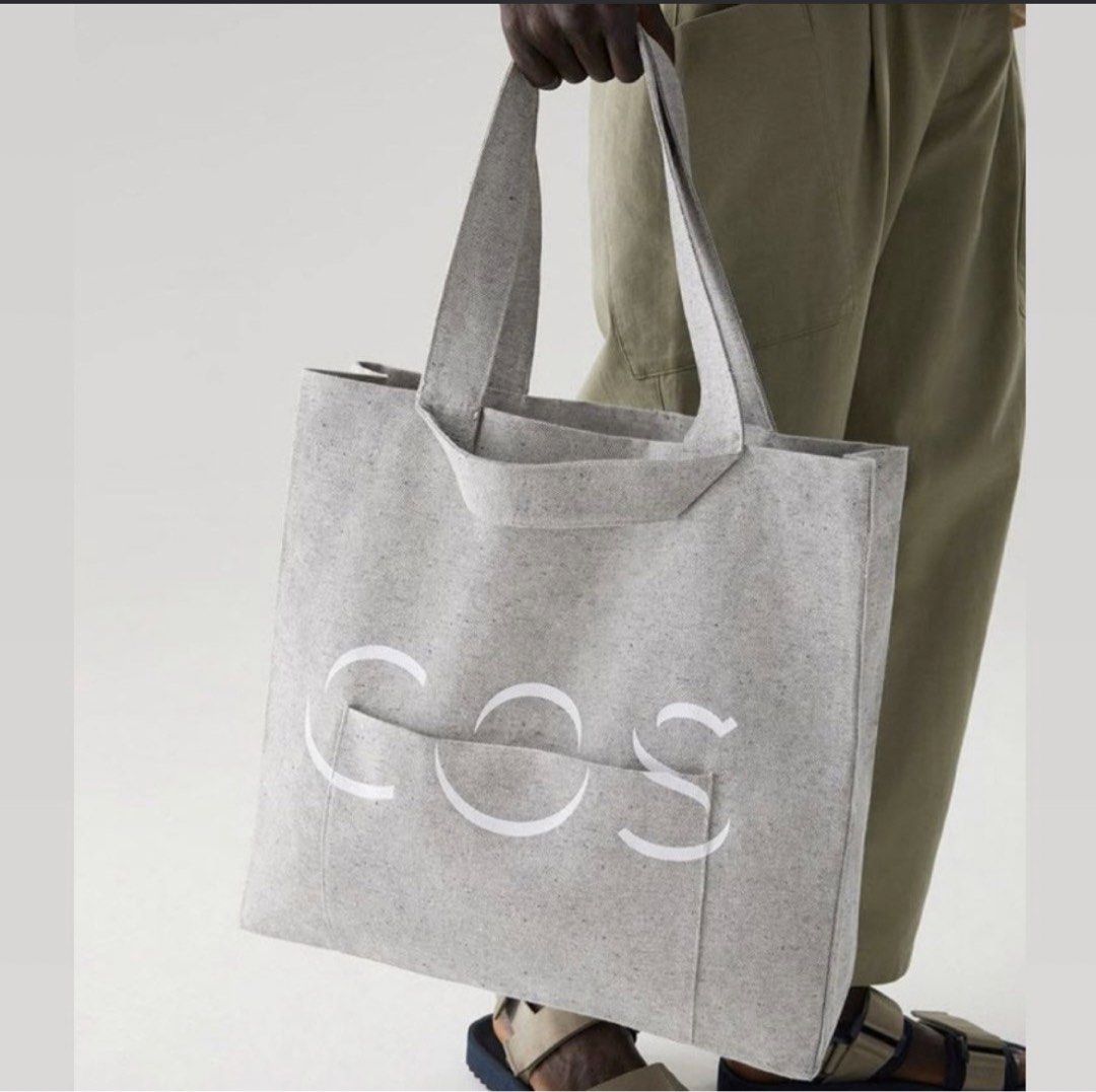 COS The Repurposed Cotton Tote Bag Grey (Category: Tote Bags) located in Tabaco. Submitted by devskie (Listing ID 1469472514, Image 2). Description: - Authentic COS The Repurposed Bag in a stylish grey speckled look - Crafted from 50% repurposed cotton and 50% regular cotton - Eco-friendly, dye-free design made to replace disposable packaging - Features the iconic white COS logo printed on the front pocket - Sturdy build ideal for everyday use - 