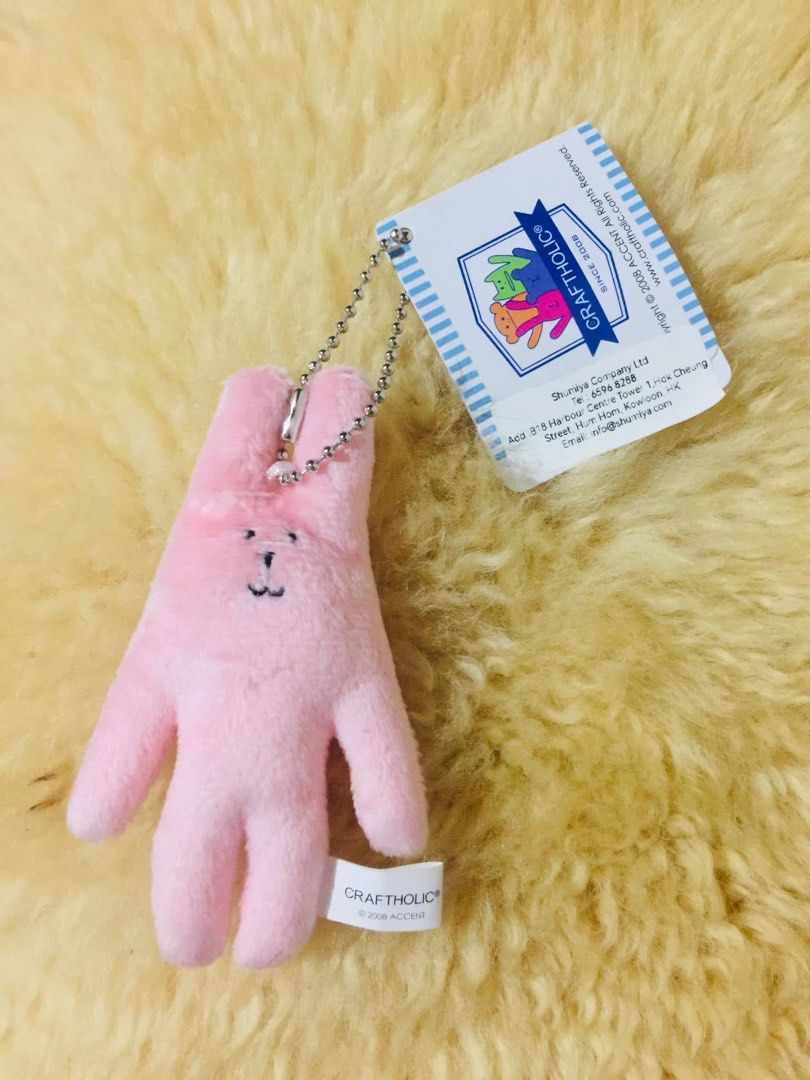 Craftholic Pink Bunny Mascot Keychain (Category: Plushies & Soft Toys) located in Baguio. Submitted by izza_thrifty (Listing ID 1469567639, Image 1). Description: - Item: Authentic Craftholic Rabbit Plush Keychain - Color: Pink - Condition: Brand new with original paper tag and cloth tag - Features: Cute embroidered face details and attached silver ball chain - Era: Official 2008 Accent merchandise - Perfect for accessorizing bags, keys, or as a 