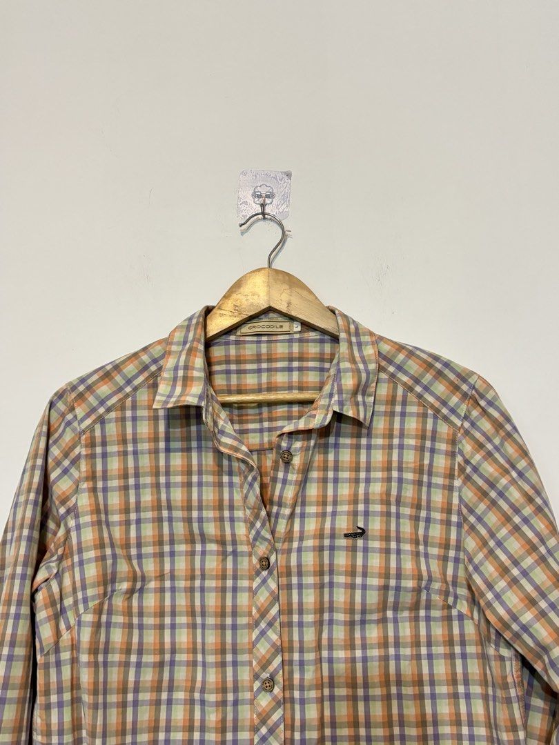 Crocodile Plaid Button-Up Long Sleeve Shirt (Category: Longsleeves) located in Bulacan. Submitted by janeeeeelleeeee (Listing ID 1469546796, Image 2). Description: - Brand: Crocodile - Style: Long sleeve button-down plaid shirt with classic collar - Pattern: Multi-colored checkered design (orange, purple, green, and white) - Details: Signature embroidered crocodile logo on the chest pocket area - Fit: Standard fit - Condition: Great for casual ev