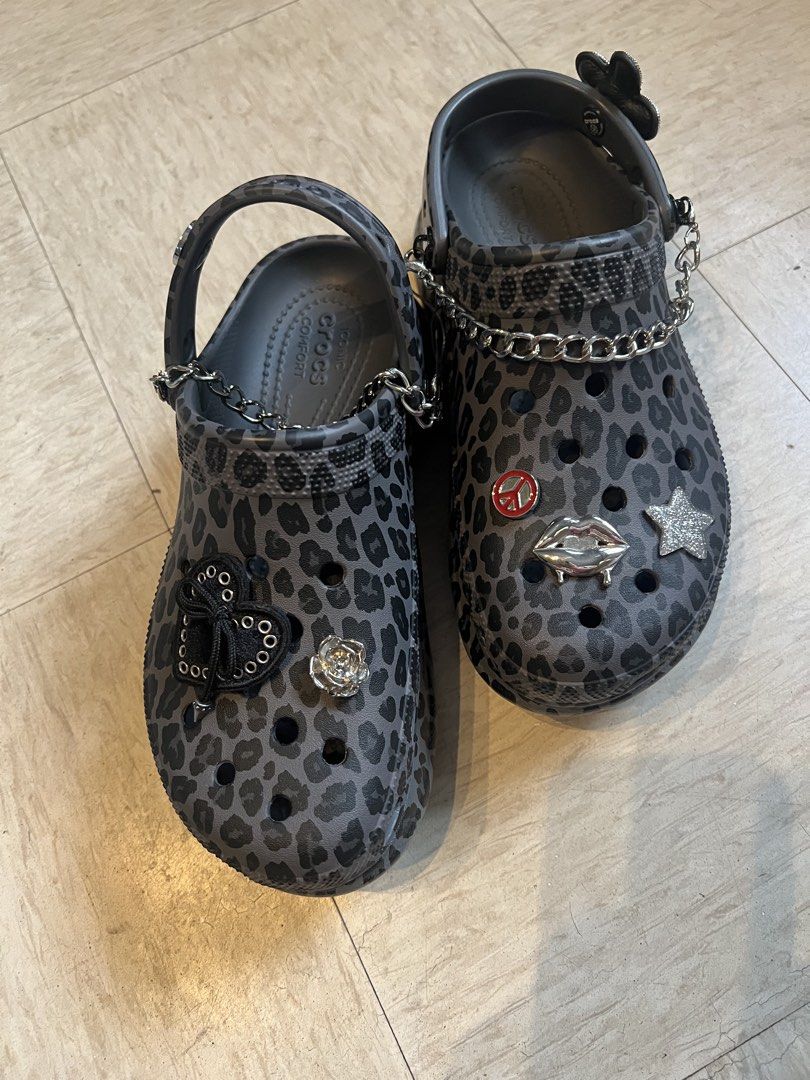 Crocs Classic Platform Leopard Print with Jibbitz Charms (Category: Slippers and slides) located in Quezon City. Submitted by Zandee (Listing ID 1469430556, Image 3). Description: - Gray and black leopard print Crocs platform clogs - Fully customized with edgy metal chains and charms - Features a black heart ribbon, sparkly star, lips, and rose charms - Super unique style that stands out instantly - Ready to wear with a totally customized look.