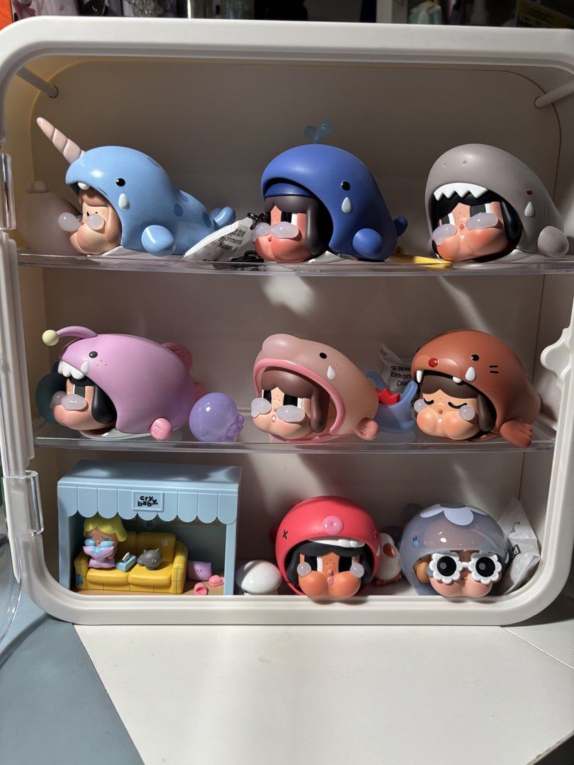 Crybaby Cry Me an Ocean - Blind Box Figures (Category: Designer & Blind Box Toys) located in Las Pinas. Submitted by silverfalcon_dbc769 (Listing ID 1469473203, Image 1). Description: - Complete Crybaby Crying Parade figure collection - Includes rare sea animal hoodies (narwhal, whale, shark, seal) - Comes with the special mini room playset on the bottom left shelf - Includes a custom white acrylic display case - Well-maintained and carefully arr