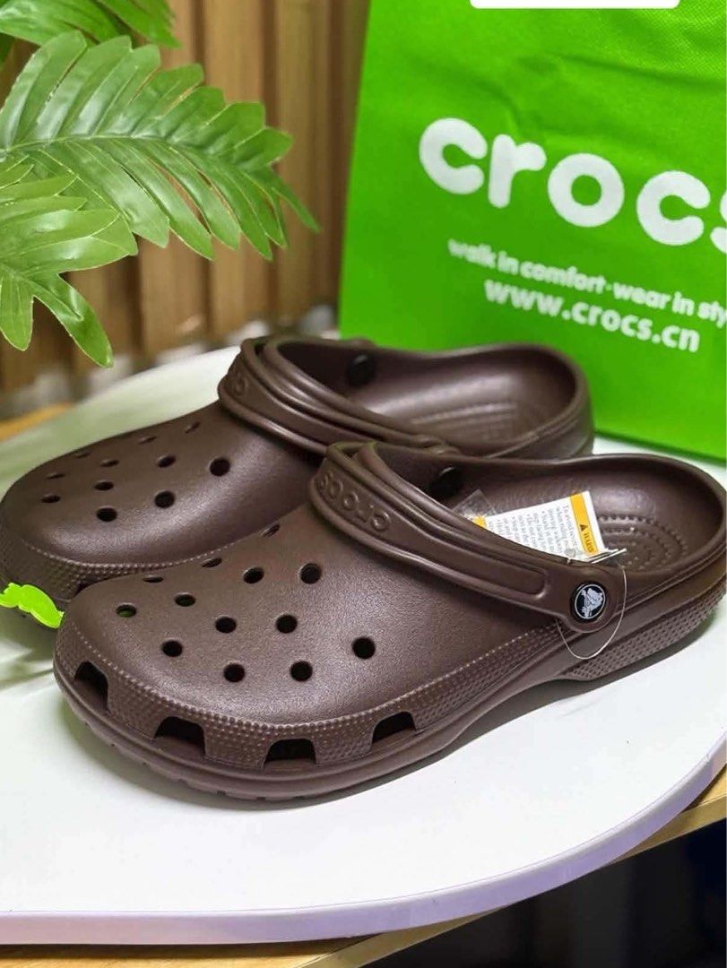 Dark Brown Classic Crocs (Category: Slippers & Slides) located in Quezon City. Submitted by stuffs.hellyy (Listing ID 1469560392, Image 1). Description: made in vietnam M9 & M10 avail sizes.