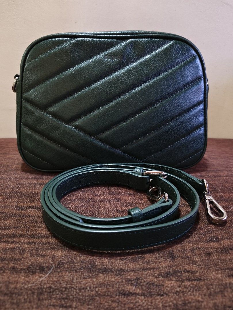 Esquire Dark Green Quilted Crossbody Camera Bag (Category: Cross-body Bags) located in Bulacan. Submitted by marichuman79038 (Listing ID 1469434536, Image 1). Description: - Color: Dark green with silver-toned hardware - Material: Pebbled leather texture with diagonal quilted pattern - Closure: Secure top zipper - Strap: Includes matching detachable and adjustable strap - Style: Compact, clean shape, and minimalist design ideal for daily essentia
