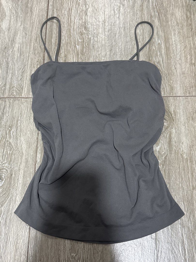Dark Grey Cami Tank Top with Spaghetti Straps (Category: Sleeveless) located in Pateros City. Submitted by sophiahipolito (Listing ID 1469520880, Image 1). Description: - Color: Dark grey - Neckline: Square neckline with thin spaghetti straps - Fit: Fitted silhouette with soft, stretchy fabric - Style: Versatile basic, great for pairing with high-waisted jeans or skirts.