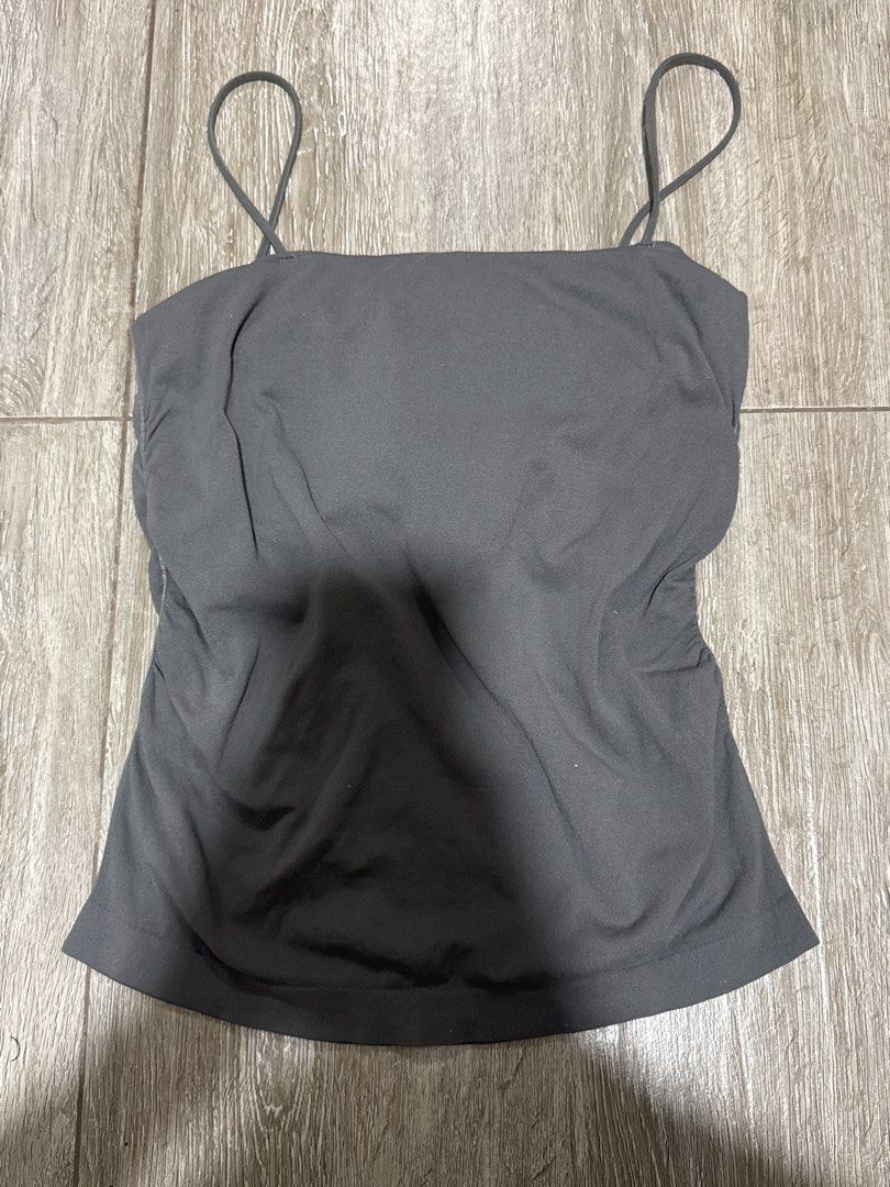 Dark Grey Cami Tank Top with Spaghetti Straps (Category: Sleeveless) located in Pateros City. Submitted by sophiahipolito (Listing ID 1469520880, Image 2). Description: - Color: Dark grey - Neckline: Square neckline with thin spaghetti straps - Fit: Fitted silhouette with soft, stretchy fabric - Style: Versatile basic, great for pairing with high-waisted jeans or skirts.