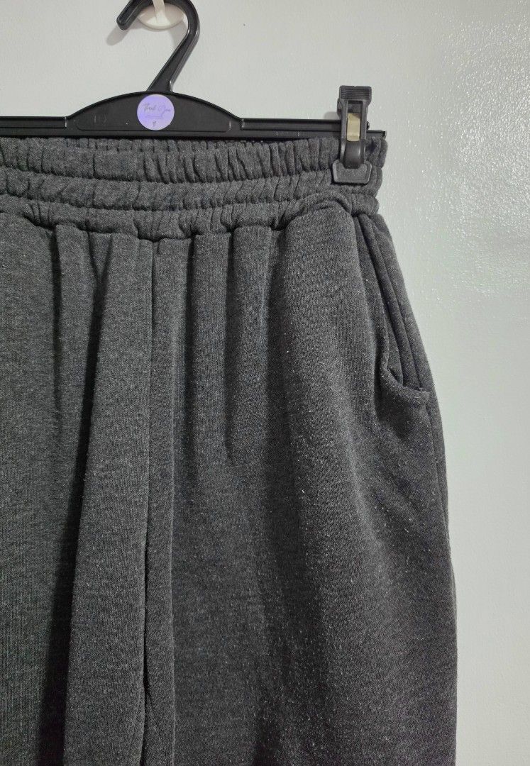 Dark Grey Jogger Sweatpants with Pockets and Cuffs (Category: Other Bottoms) located in Paranaque City. Submitted by franinnashop (Listing ID 1469457845, Image 2). Description: Declutter - Color: Dark grey - Material: Super comfy fleece, perfect for everyday wear - Waist: High elastic waistband (stretches 22-30 inches) - Pockets: Deep side pockets on both sides - Cuffs: Elastic cuffs at the ankles - Measurements: Length 34.5 inches, Inseam 22 inc
