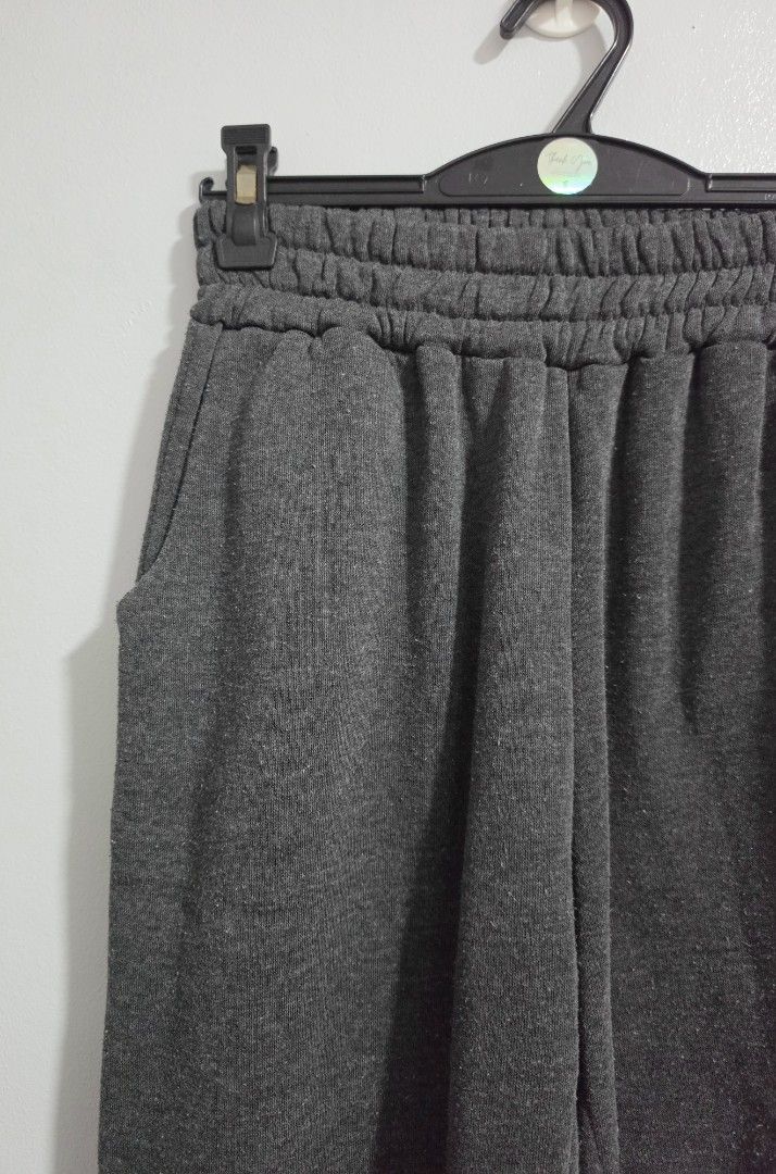 Dark Grey Jogger Sweatpants with Pockets and Cuffs (Category: Other Bottoms) located in Paranaque City. Submitted by franinnashop (Listing ID 1469457845, Image 3). Description: Declutter - Color: Dark grey - Material: Super comfy fleece, perfect for everyday wear - Waist: High elastic waistband (stretches 22-30 inches) - Pockets: Deep side pockets on both sides - Cuffs: Elastic cuffs at the ankles - Measurements: Length 34.5 inches, Inseam 22 inc